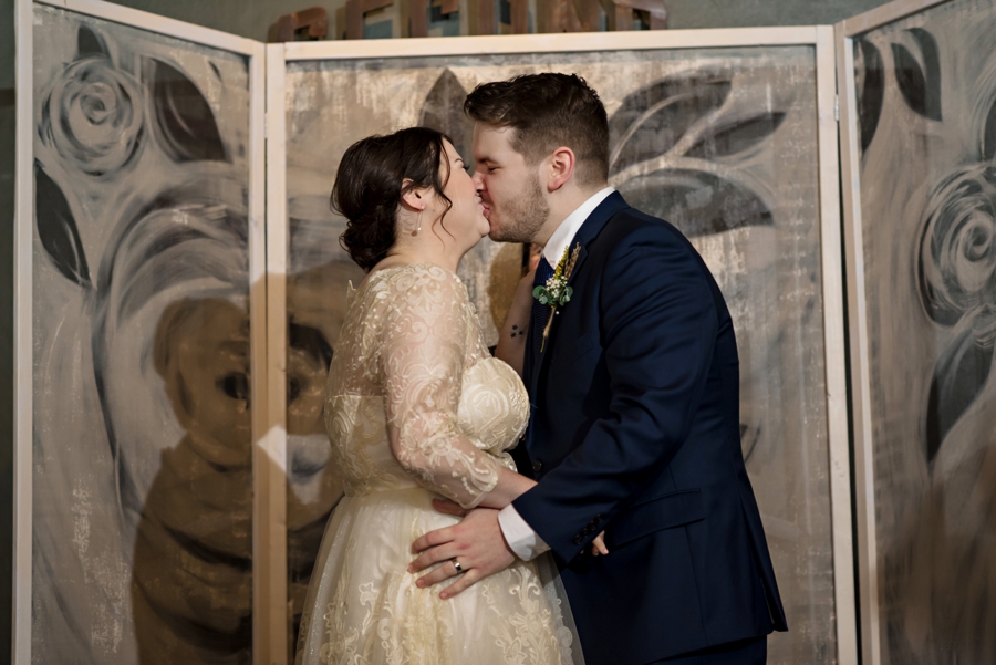 First kiss as husband and wife.